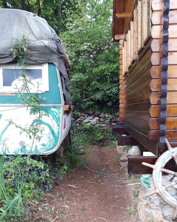 view of now clear access bewteen caravan and workshop